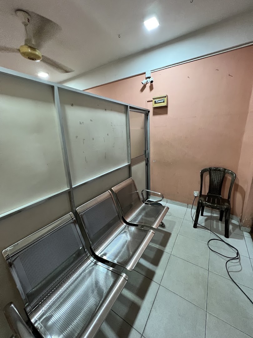 Clinic waiting area with stainless steel seats and peach walls